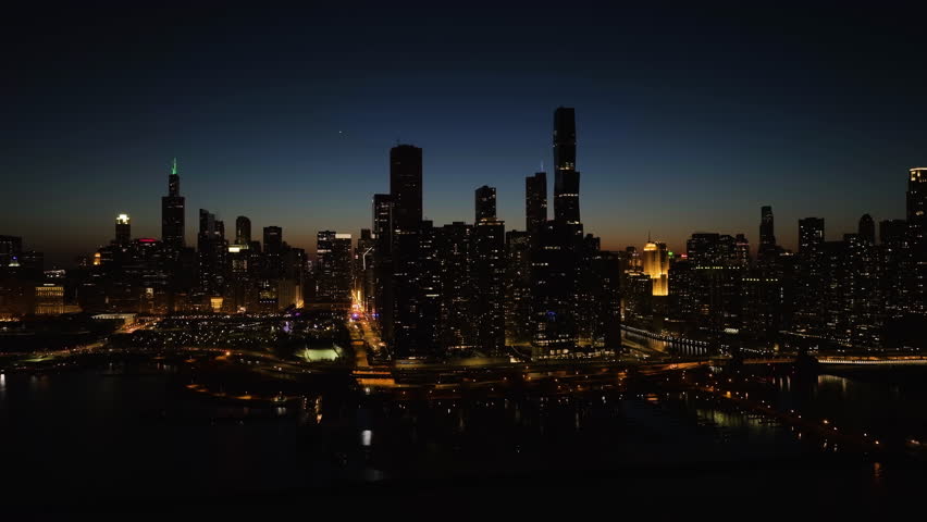 Chicago , United States - 04 20 2023: Hyperlapse drone shot around the New Eastside skyscrapers, night in Chicago, USA