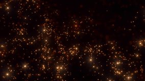 Background of golden shimmering particles. Abstract animation of defocused glowing particles in slow motion. Seamless loop
