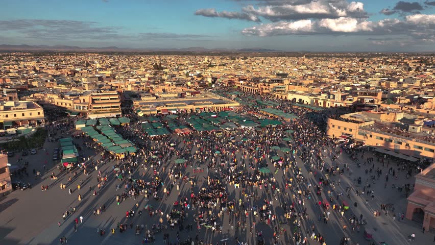 Drone shot of the Jemaa el-Fna square in the afternoon - 4K 2023 Royalty-Free Stock Footage #1102849359