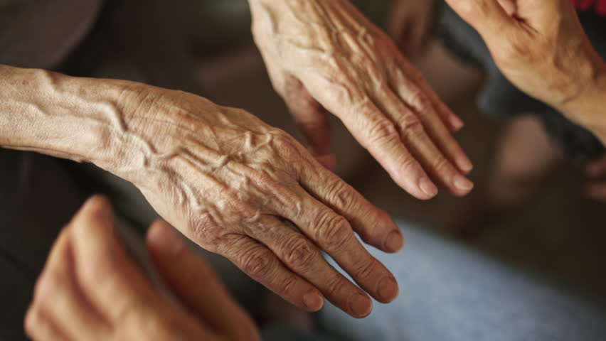 Woman and kid holds the hands of an old senior grandmother strokes them and provides support. The concept of family caring for old people. Royalty-Free Stock Footage #1102853261