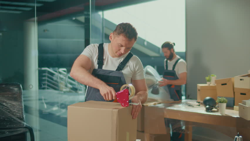 Professional Packing and Unpacking Services. Packing and Preparation for Moving. Shipping and Packaging Business Occupation Service Company. Preparation for a Long Trip, Transportation of Things. Royalty-Free Stock Footage #1102861349