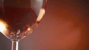 Small air bubbles floating in the rose wine in a wineglass. Slow motion, close up. - Powered by Shutterstock - Get 15% off with code: PIKWIZARD15