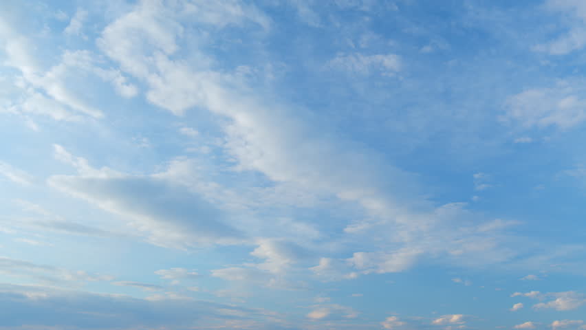 Clouds move in the blue sky. Tropical sky at day time, only white and blue colors. Semi-transparent layers on different height. Time lapse. Royalty-Free Stock Footage #1102869177
