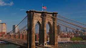 Brooklyn Bridge traffic American Flag NYC Downtown Manhattan Buildings FDR Drive traffic East River Waterfront Summer Day Aerial View - Powered by Shutterstock - Get 15% off with code: PIKWIZARD15