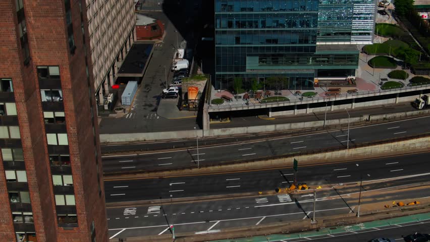 COVID Refrigerator Trucks Tents FDR Drive traffic NYC Midtown Manhattan NYU Langone Hospital Alexandria Center Empire State Building Aerial tilt up