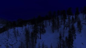 Night Aerial Shot of Snow Covered Winter Mountains Forward California USA Day for Night - Powered by Shutterstock - Get 15% off with code: PIKWIZARD15