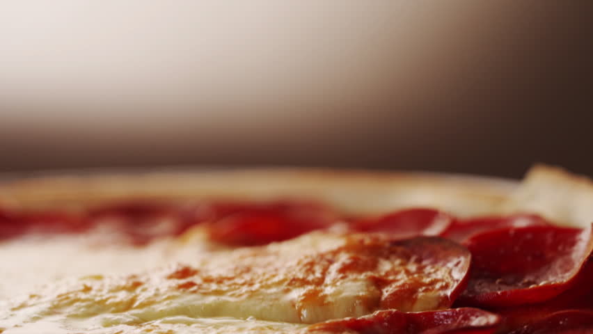 I took a slice of freshly baked pizza with delicious elastic cheese. Delicious Italian pizza baked in an oven on a black background Royalty-Free Stock Footage #1102877647