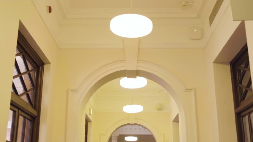 Long empty hallway of a large building.