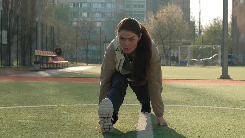 Girl Doing Stretching In The Stadium Like An Amateur Or Beginner