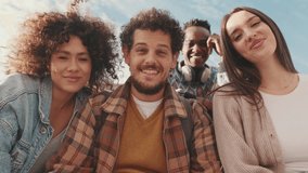 Happy smiling friends make a video call in a laptop. Four students wave their hands in greeting - Powered by Shutterstock - Get 15% off with code: PIKWIZARD15