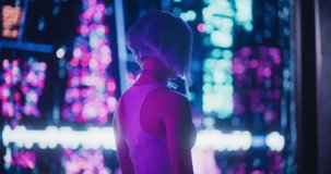 Creative Young Female Standing in a Sci-Fi Cyberpunk City with Neon Lights, Dystopian Colorful Urban Environment. Cosplay Model with Blue Hair Excited About Technological Surroundings