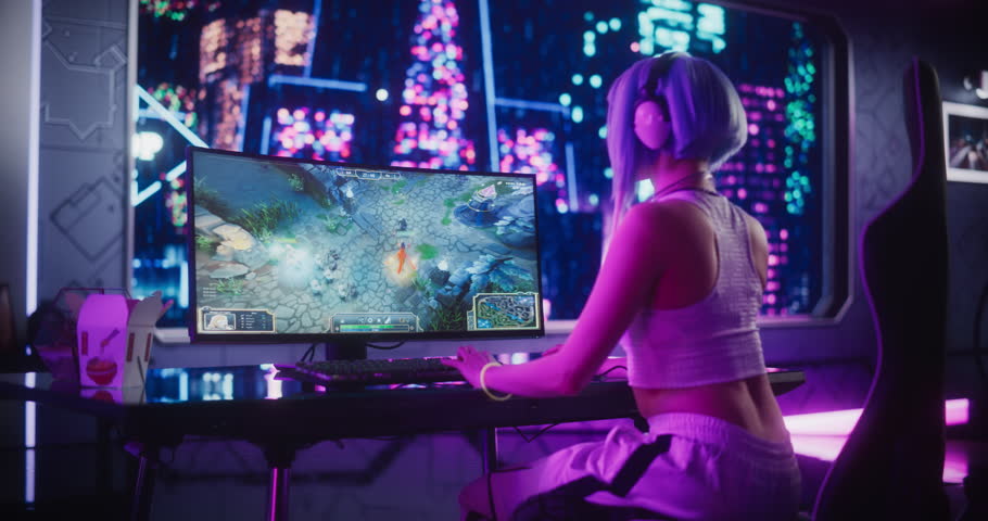 Stylish Female Gamer Playing Fantasy Strategy Video Game with Modern Graphics on Her Computer. Futuristic Cyberpunk Gaming Neon Room with Cosplay Gamer Girl in Headphones. Footage from the Back Royalty-Free Stock Footage #1102884975