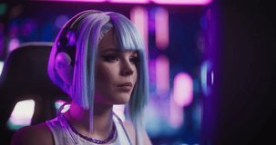 Stylish Streamer or Gamer with Blue Hair Chats with Internet Fans on Computer in Futuristic Cyber Technology Room. Footage for Social Media, Streaming, and Gaming Content