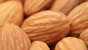 Almond nuts extreme macro, rotation. Healthy vegan food concept