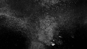 dust particals flying against black background 4k