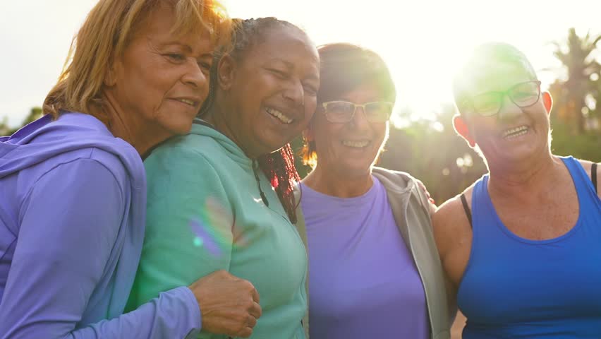 Group of multiracial senior women smiling in front of camera after sport workout outdoor - Healthy lifestyle and fit elderly friendship concept Royalty-Free Stock Footage #1102896019