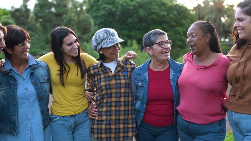 Group of multigenerational women hugging each other while smiling in front of camera - Diverse women and community concept Royalty-Free Stock Footage #1102896029