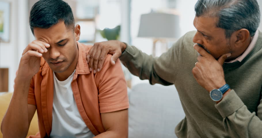 Depression, support or trust with a father and son talking in the living room to comfort, console or care. Family, love and empathy with a senior parent helping a man through pain, grief or loss Royalty-Free Stock Footage #1102914425