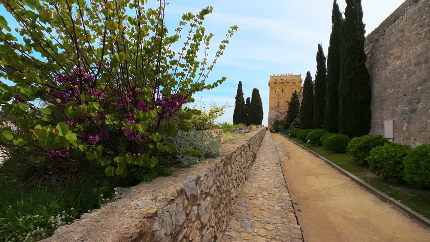 A view of Archaeological Walk, with monumental roman walls, in Tarragona, Spain. High quality 4k footage