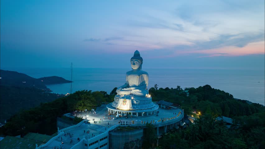 aerial Hyperlapse view Phuket Big Buddha is one of the island most .important and revered landmarks on hill top of Phuket island..beautiful sunset behind Phuket big buddha.beautiful nature background Royalty-Free Stock Footage #1102924801