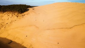Aerial view Dune of Pilat, Dune du Pyla, the tallest sand dune in Europe, Arcachon Bay, Aquitaine, France. High quality 4k footage