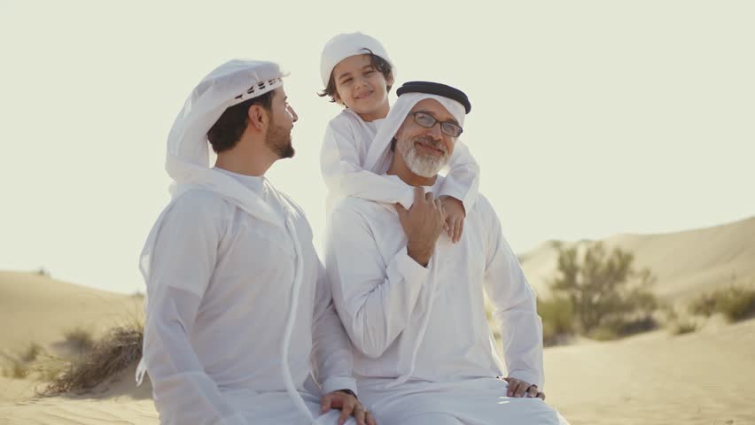 Three generation family spending time in the desert making a safari in Dubai. Concept about middle eastern cultures and lifestyle in the emirates Royalty-Free Stock Footage #1102927087