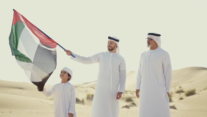 Three generation family spending time in the desert making a safari in Dubai. Concept about middle eastern cultures and lifestyle in the emirates