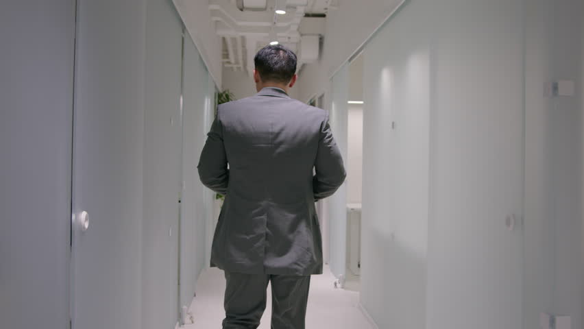 Back view unknown businessman entrepreneur ceo employer hurry run on business meeting with partners in office busy man go in company hallway checking hour on wristwatch late time management lateness Royalty-Free Stock Footage #1102935011