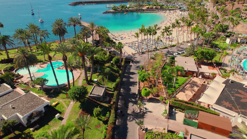 Aerial view of the Playa de la Verga beach, Gran Canaria, Canary Islands, Spain. Luxury holidays destination on Canary islands. Turquoise sea water beach in Atlantic ocean and big hotel complexes