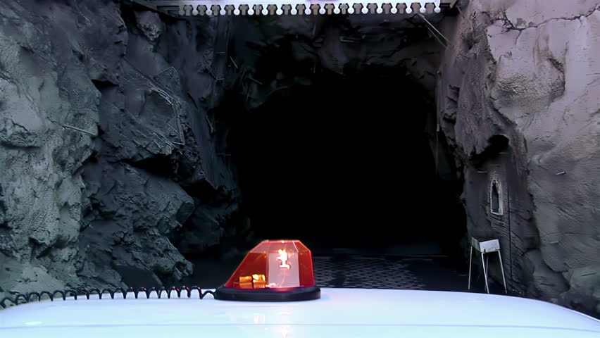 Mining Truck Entering Underground Iron Mine Tunnel With Warning Light, Sierra Grande, Argentina - 4K