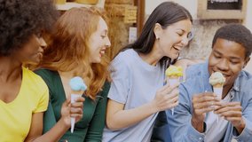 Multiethnic friends laughing while eating ice cream on the street - Powered by Shutterstock - Get 15% off with code: PIKWIZARD15