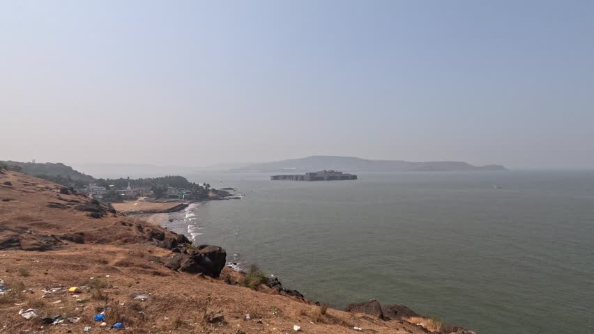 Distant view of the Murud Janjira Fort from the coastal mountain in the ocean