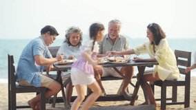 Happy Multi-Generation Asian family having celebration dinner food and drink together at tropical beach restaurant during travel ocean on summer holiday vacation at sunset. Family relationship concept - Powered by Shutterstock - Get 15% off with code: PIKWIZARD15