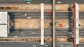 Elevated road construction site is a complex environment. Materials like sand, gravel, cement, and steel beams are transported in and out of the site, making it a bustling hub of activity. Drone
