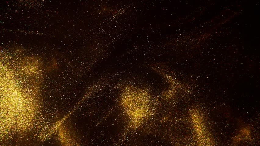 Abstract bronze paint . Shooting on a black background. gold paint dances in mixed water against a dark backdrop.