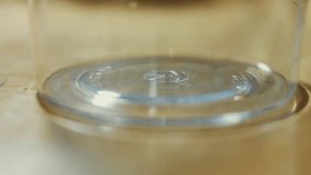Pouring pancake batter into a glass. Process of preparing pancakes. 4K video