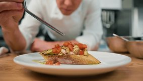 Professional chef puts avocado and tomato on toast with spices pouring sauce over concept of healthy food breakfast - Powered by Shutterstock - Get 15% off with code: PIKWIZARD15