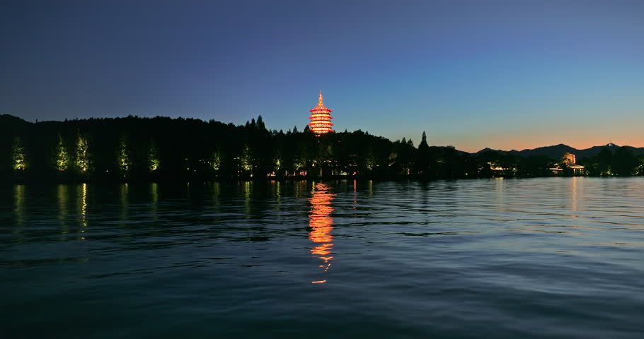 Beautiful West Lake natural landscape at night in Hangzhou, China. Ancient Leifeng Pagoda with lake scenery in Hangzhou. 