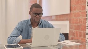 Online Video Chat by African Man on Laptop
