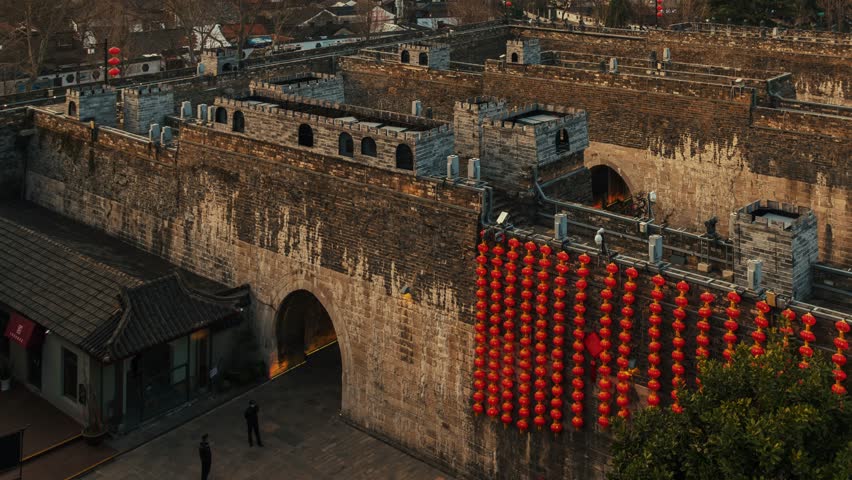 Old city wall with urban buildings timelapse view of Nanjing city in Jiangsu, China