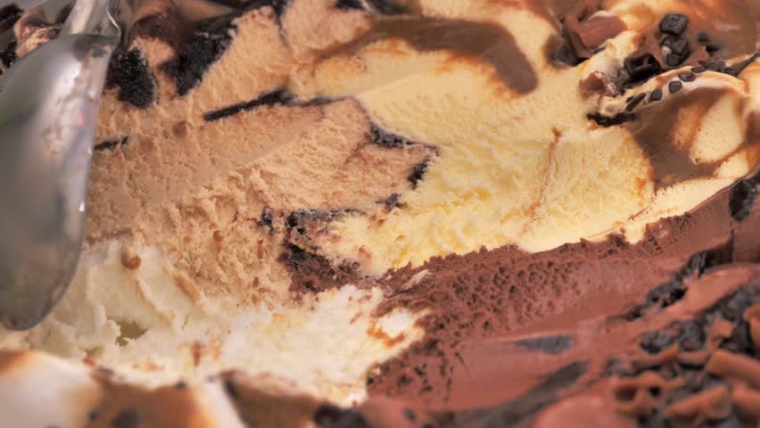 Slow motion Close up Ice cream Chocolate Chip scooped out from container with a spoon, Food concept. Royalty-Free Stock Footage #1102960441