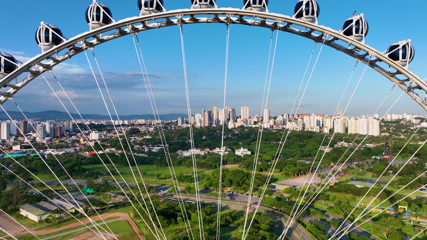 Ferris Wheel At Candido Portinari Park Sao Paulo Brazil. Ferris Wheel Riding. Avenues Landscape Metropole Awesome. Avenues Urban Metropole Commercial Building Town. Avenues Awesome Day Path. Royalty-Free Stock Footage #1102961905