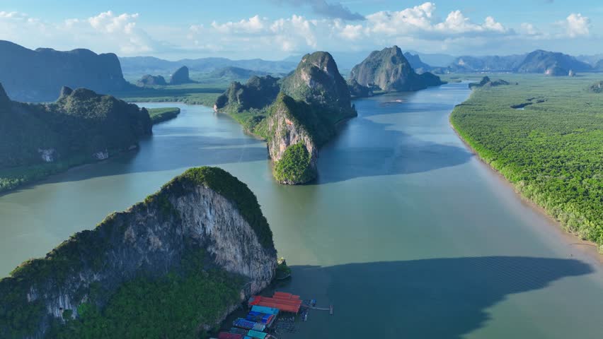 floating fishing village at Koh Panyee, flying above a famous destination in Phang Nga Bay, Thailand, floating muslim fishing village in Thailand Royalty-Free Stock Footage #1102967555