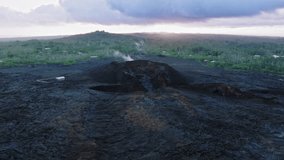 Helicopter aerial of eruption of the Kilauea volcano on Big Island, Hawaii state, USA 4K aerial travel destination. Scenic black burnt aftermath landscape of Pahoa city by volcano eruption in 2018 - Powered by Shutterstock - Get 15% off with code: PIKWIZARD15