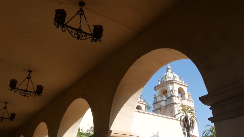 Spanish colonial revival architecture, Balboa Park, San Diego, California USA. Historic building, classic baroque or rococo romance style. Arches and columns of Casa, archway, vault, arcade or passage Royalty-Free Stock Footage #1102976249