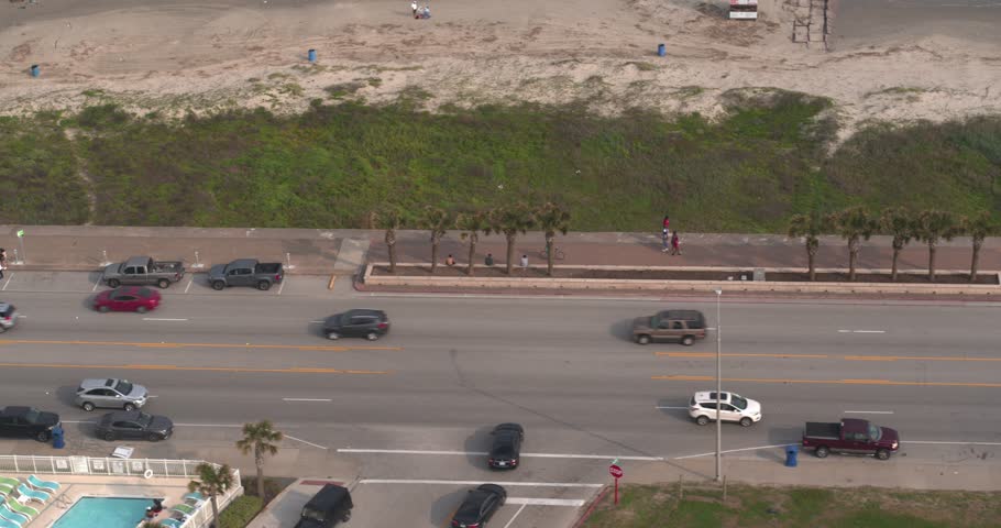 4k Drone view of cars driving on the Seawall Blvd in Galveston Texas