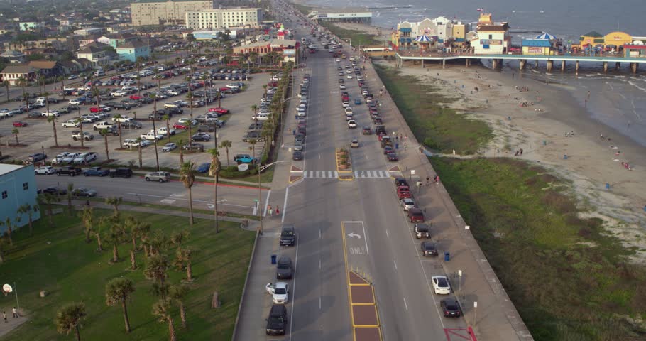 4k Drone view of cars driving on the Seawall Blvd in Galveston Texas