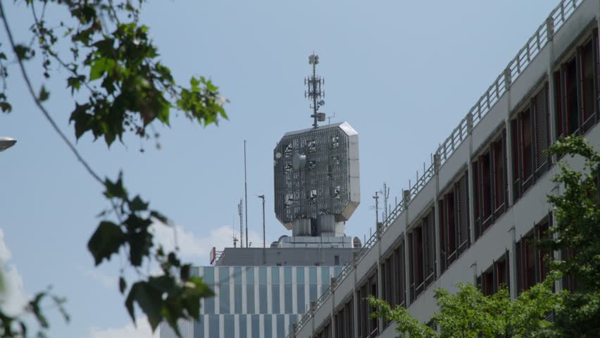 Radio tower on top of a building in Geneva, Switzerland