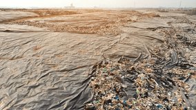 Landfill waste can have negative environmental impacts if not properly managed, as it can release harmful chemicals and gases into the environment during decomposition. Environmental pollution concept