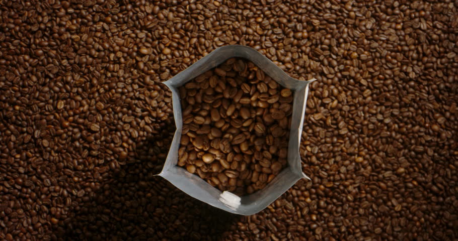 Keep fresh for natural roasted coffee beans fall pour in package Royalty-Free Stock Footage #1102981647